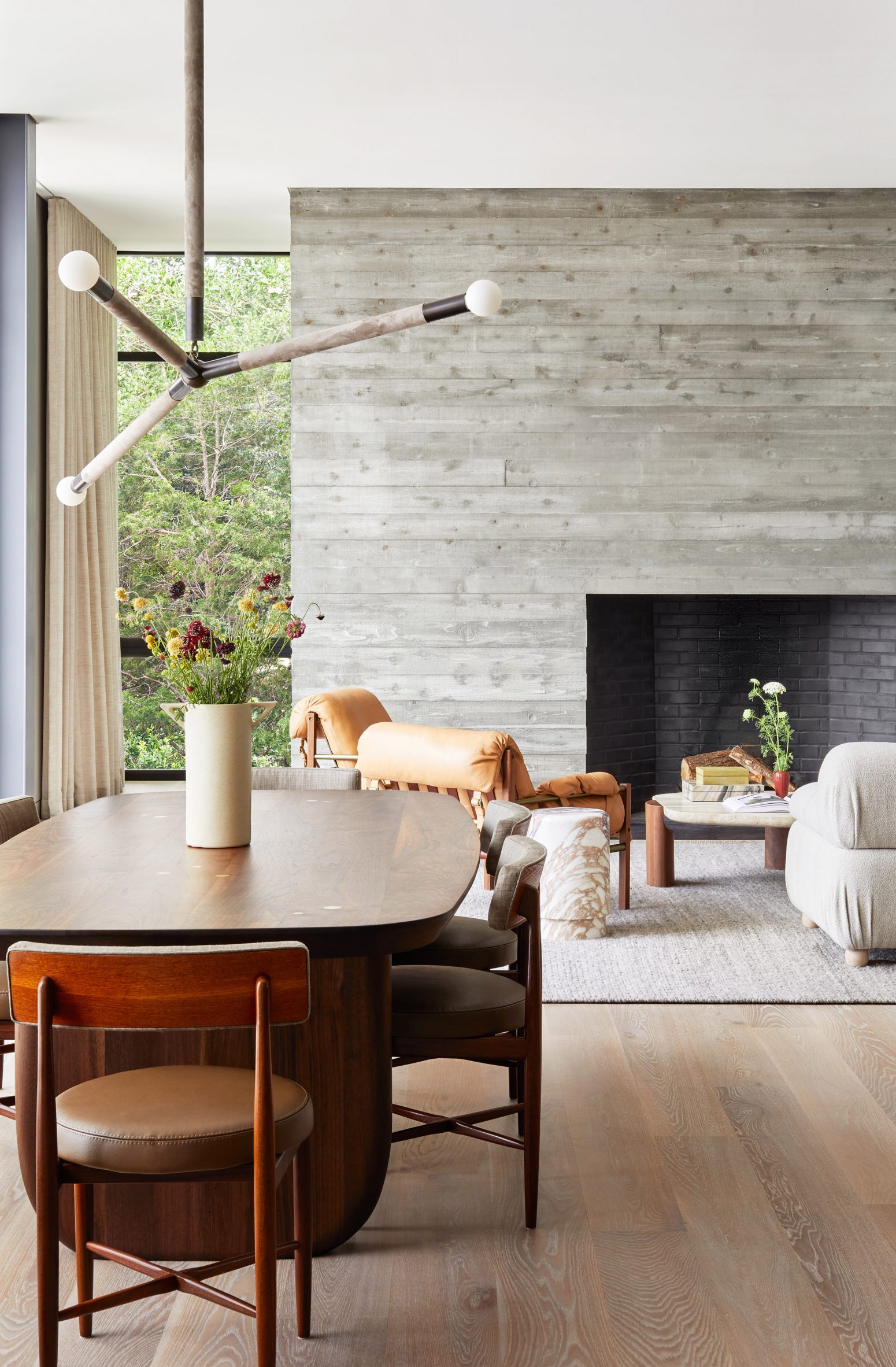 Board-marked concrete fireplace in the interior of a house in the Hamptons