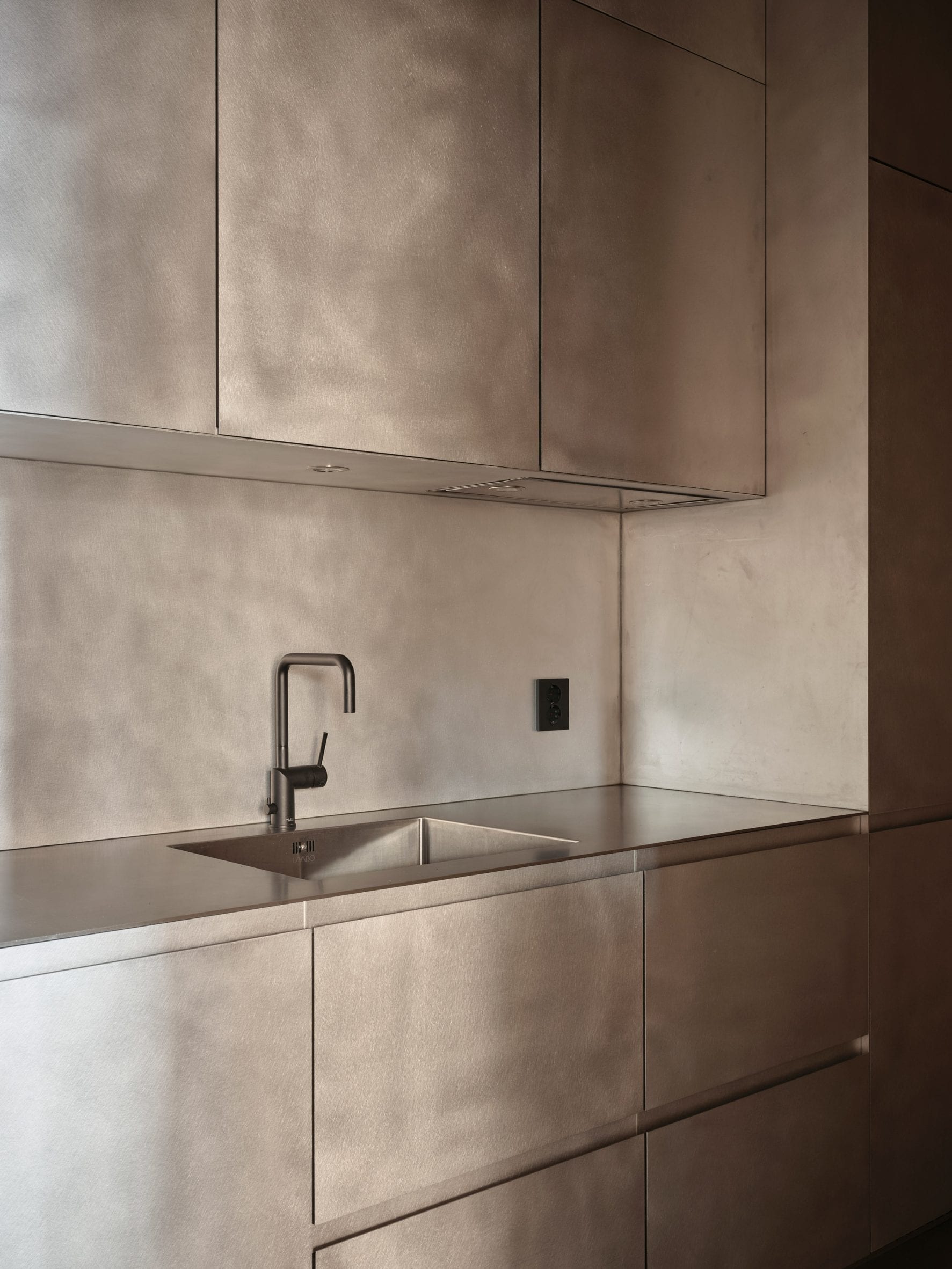 Cabinetry at samsen atelier was finished with a silver hue