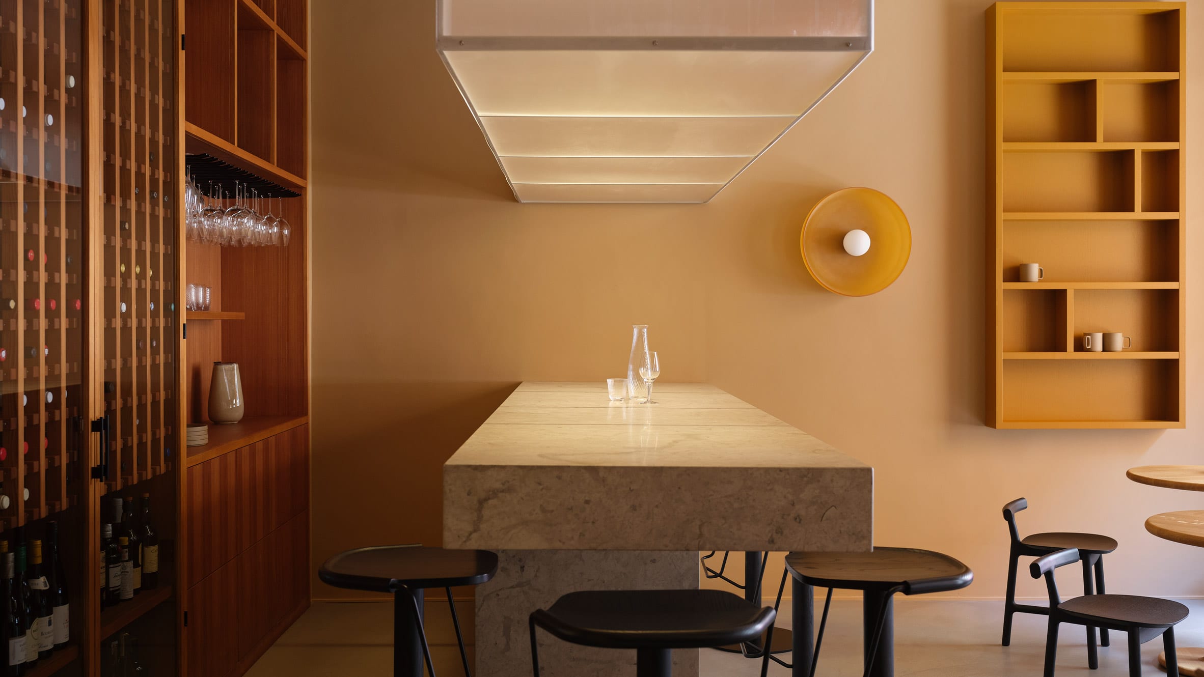Note Design Studio creates warm-hued wine bar that doubles as an office