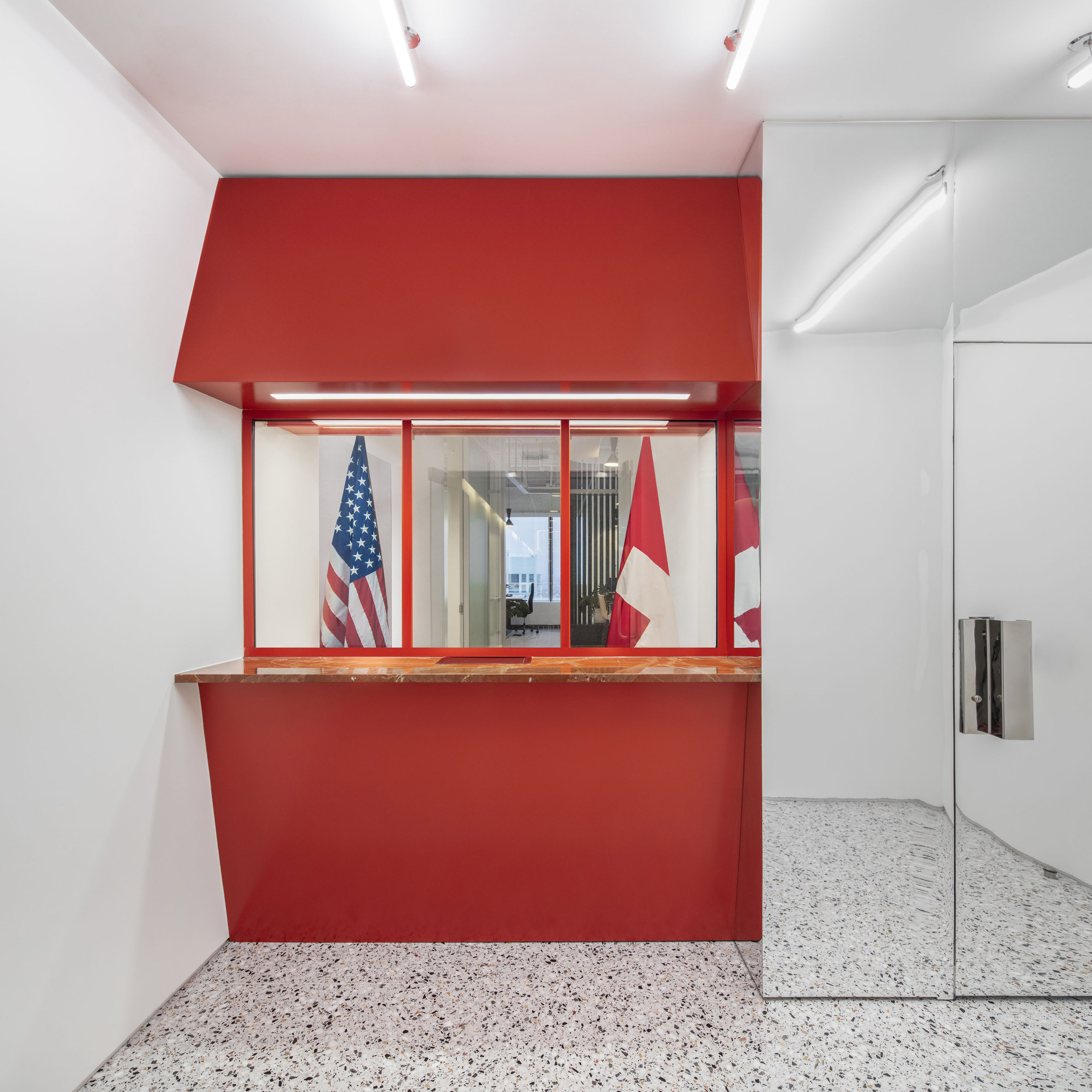 Reception booth and chrome door of Swiss Consulate in Chicago
