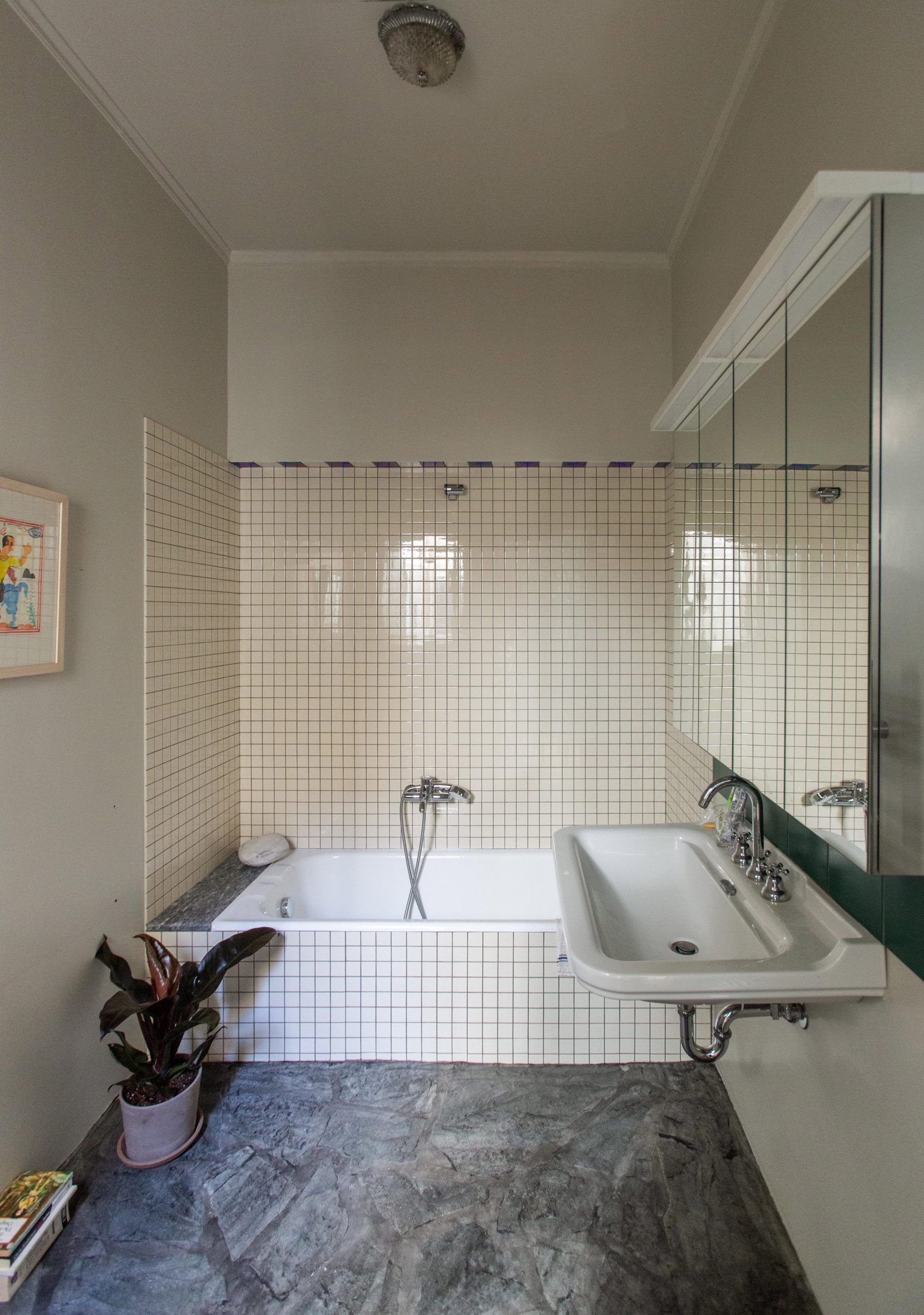 Bathroom with white tiles and marble flooring in Trikoupi apartment