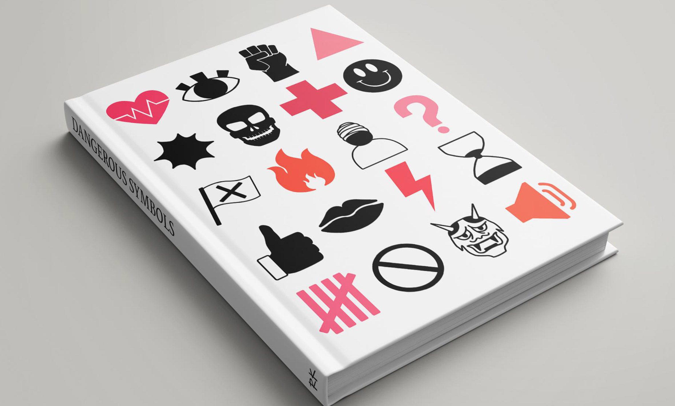 A graphic design book with various symbols on its cover