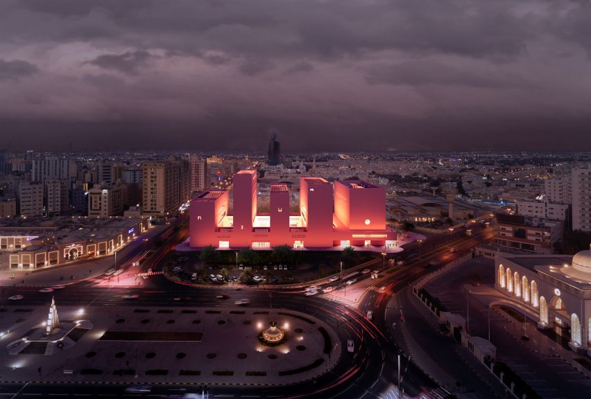 A red-hued concrete building in Sharjah