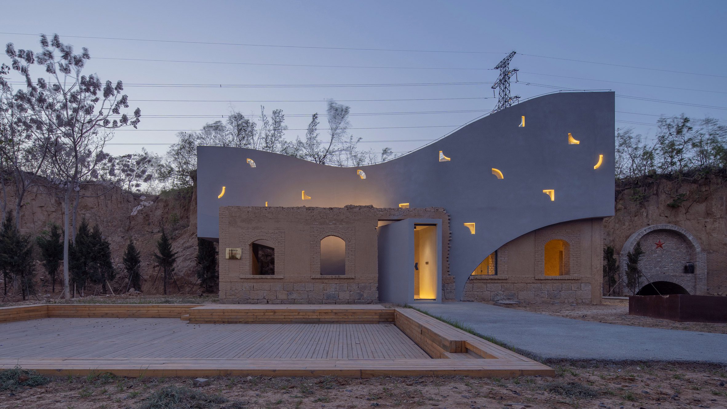 Atelier Xi transforms abandoned house into curved concrete library