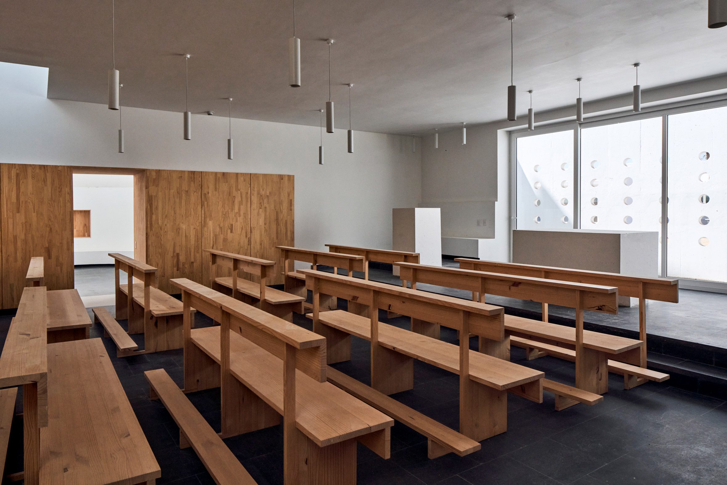 The classrooms feature neutral wooden cabinetry
