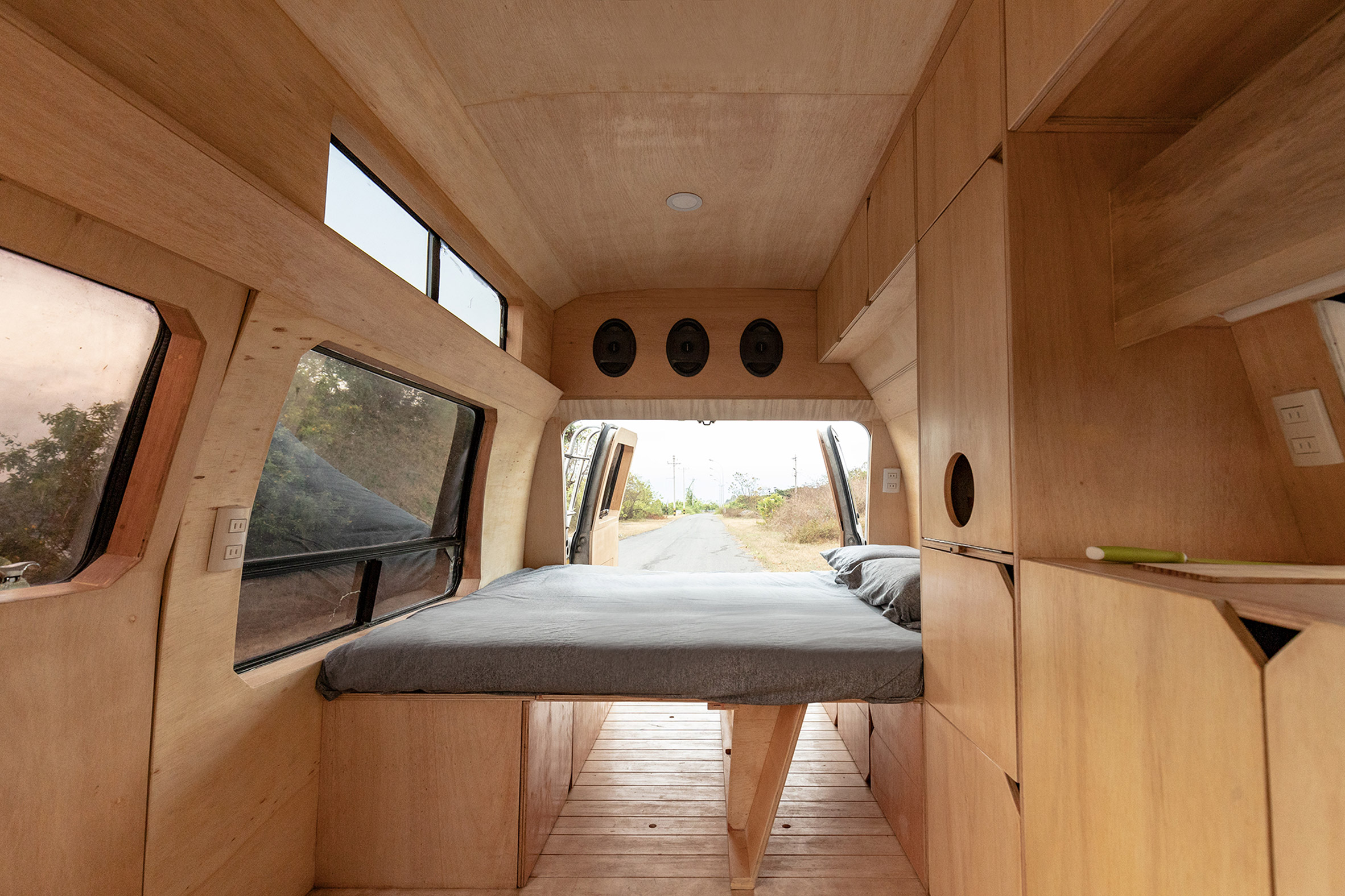 A grey mattress inside a mobile home