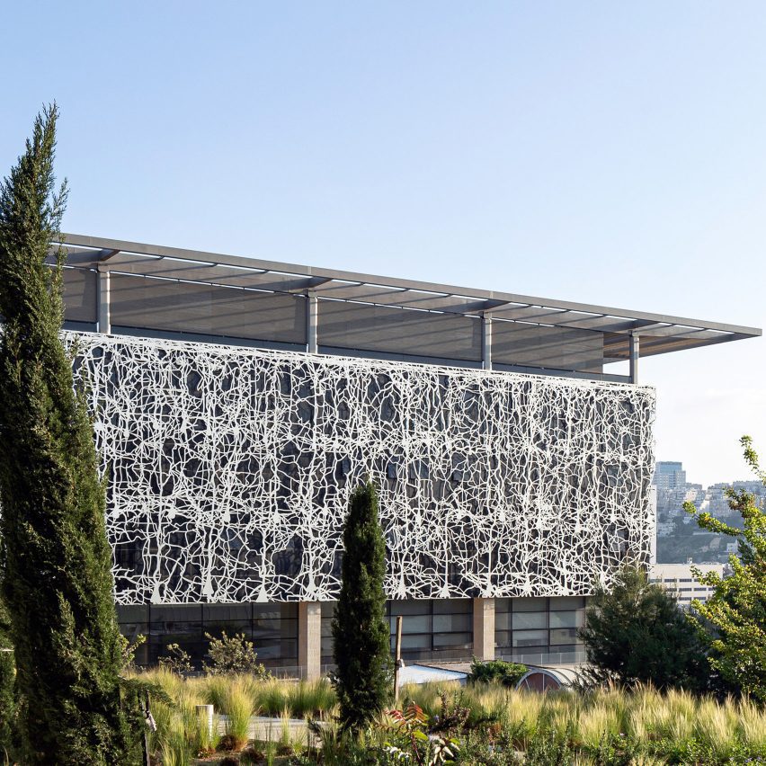 A building clad with metal screens