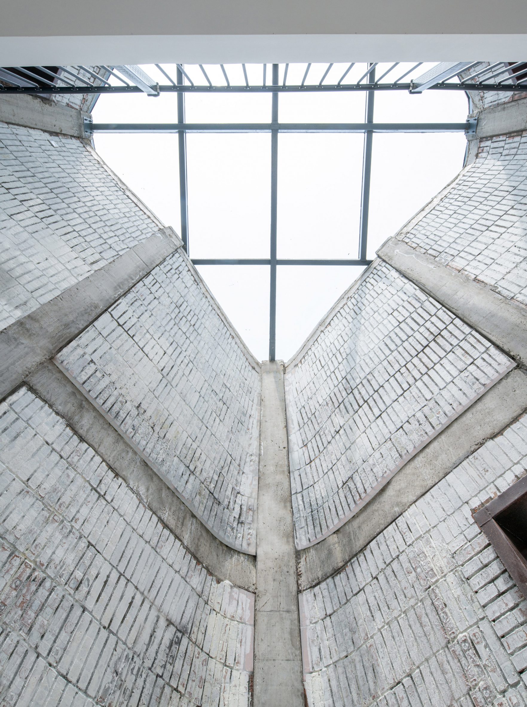 Brick-clad interior lightwell in pods of Grotto Retreat Xiyaotou 