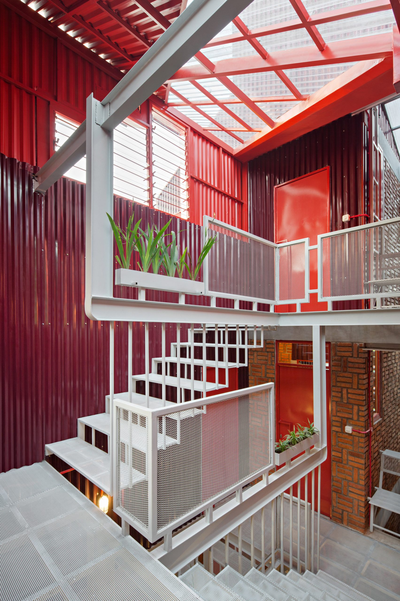 Ismail Solehudin Architecture Builds Bright Red Indonesian Boarding House