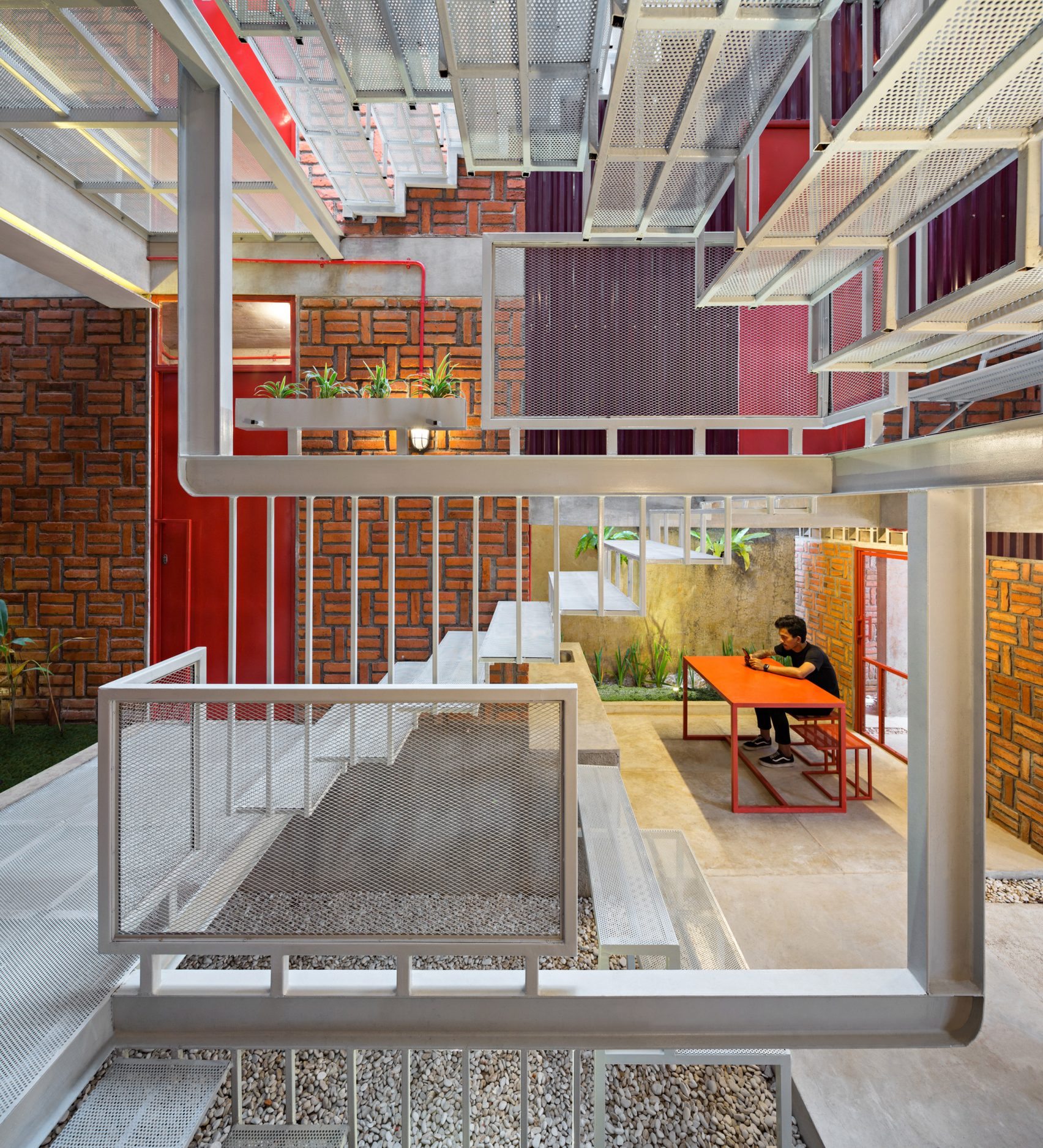 Ismail Solehudin Architecture Builds Bright Red Indonesian Boarding House