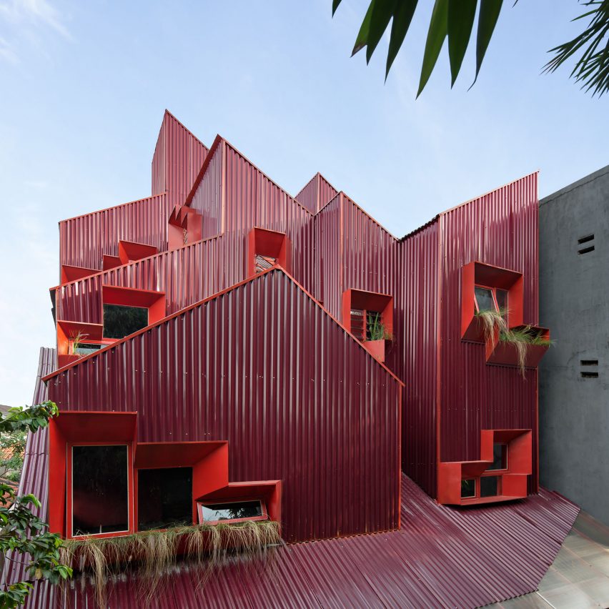 Exterior of Stack by Step Red Zone Boarding House by Ismail Solehudin Architecture