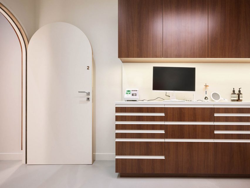 A brown counter in a dentist's next to a white door