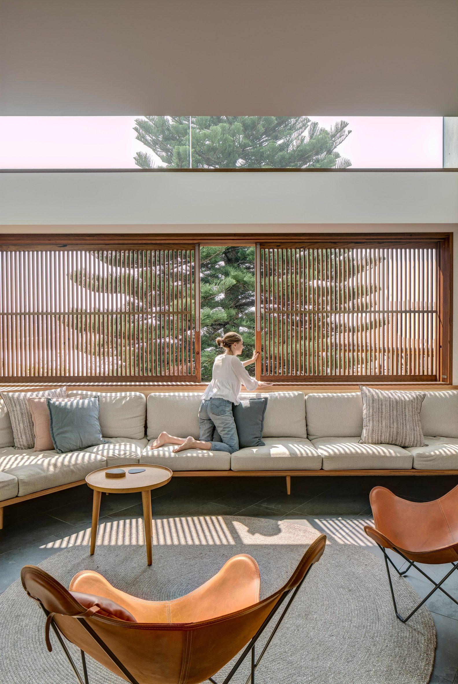 Slatted shutters line the living room windows in this Australian house