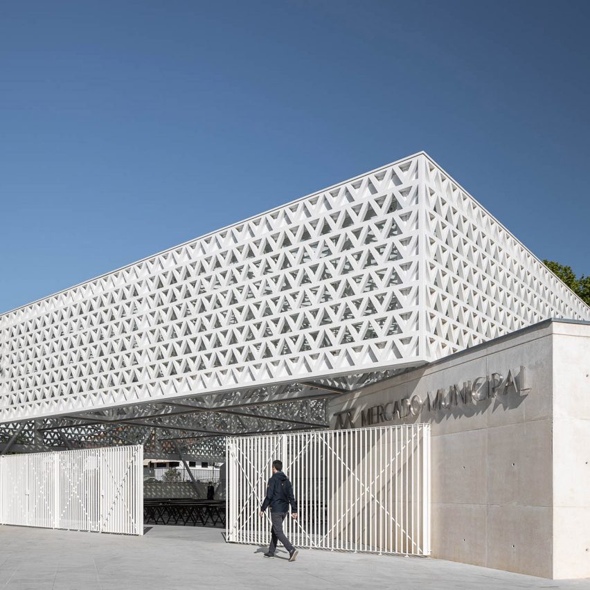 Triangular-patterned canopy shelters stalls at modernised Portuguese marketplace