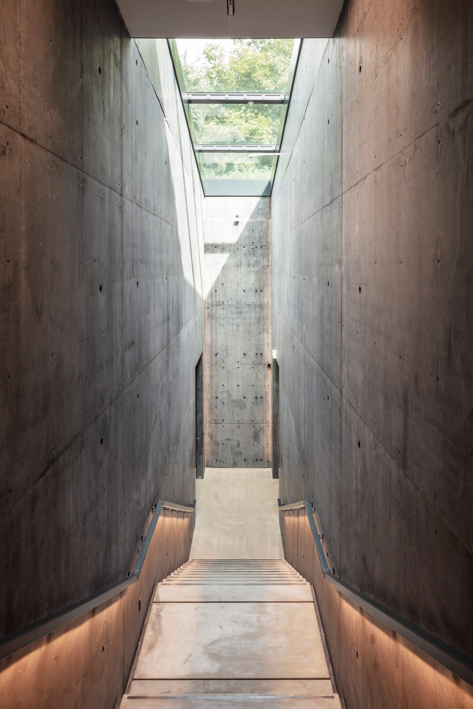 Snohetta Ordrupgaard Museum interior with dark concrete palette
