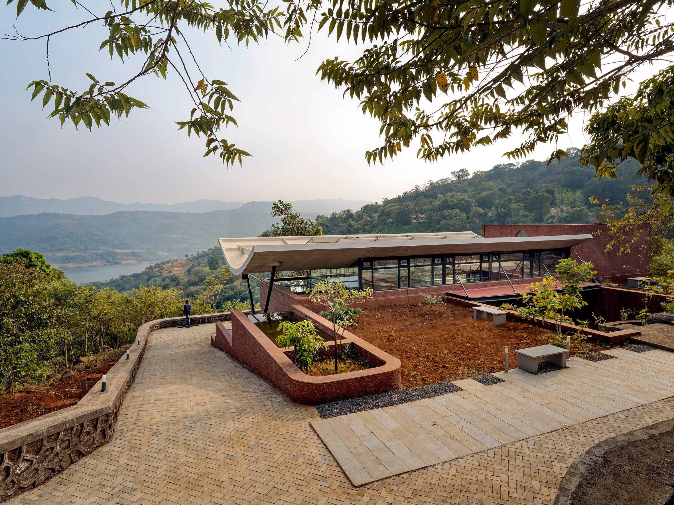 A brick house overlooking the Western Ghats mountain range