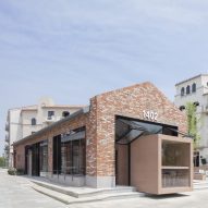 BLUE Architecture adds rectangular coffee shop to red brick building in Aranya