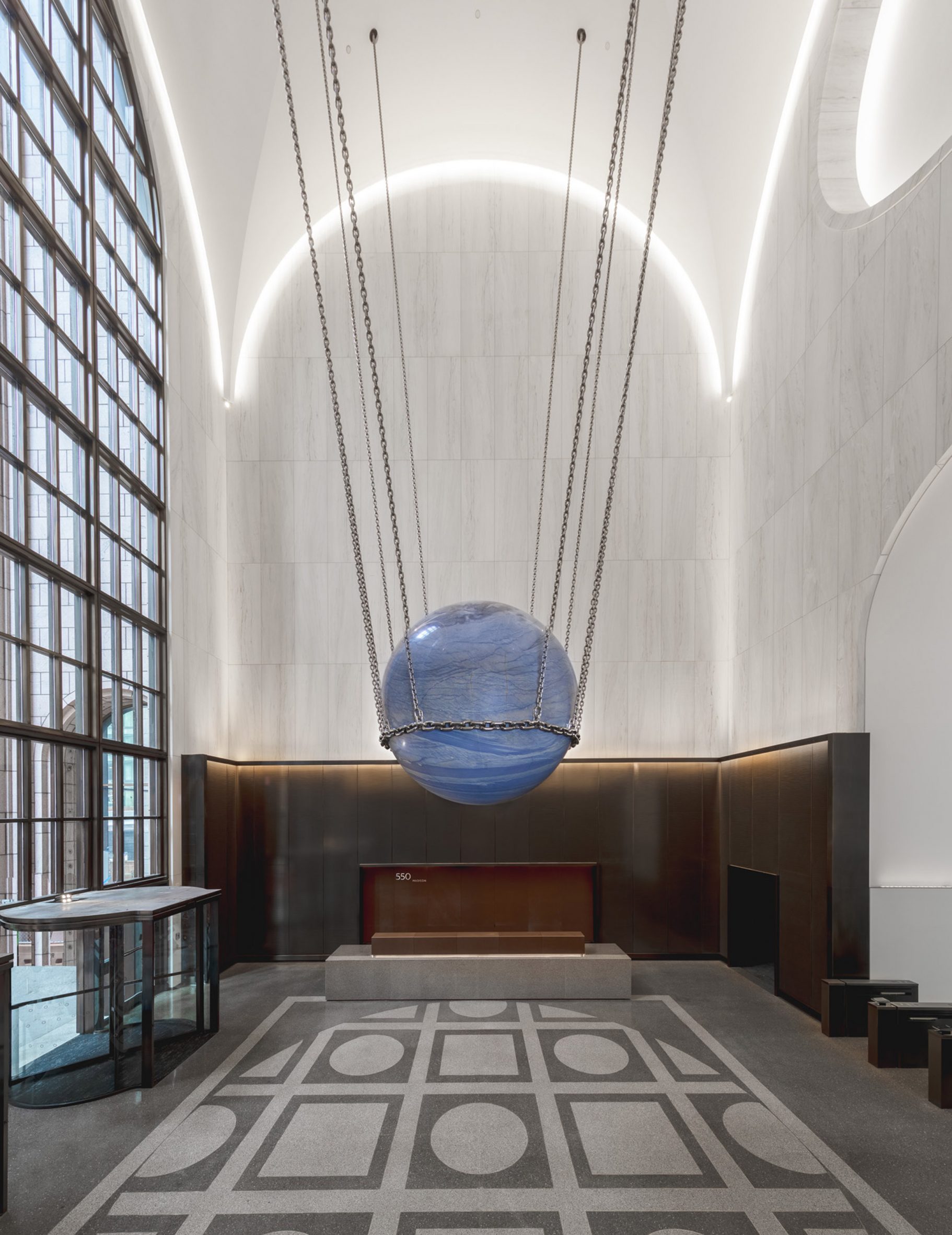 White marble was used across the walls of the lobby of 550 Madison