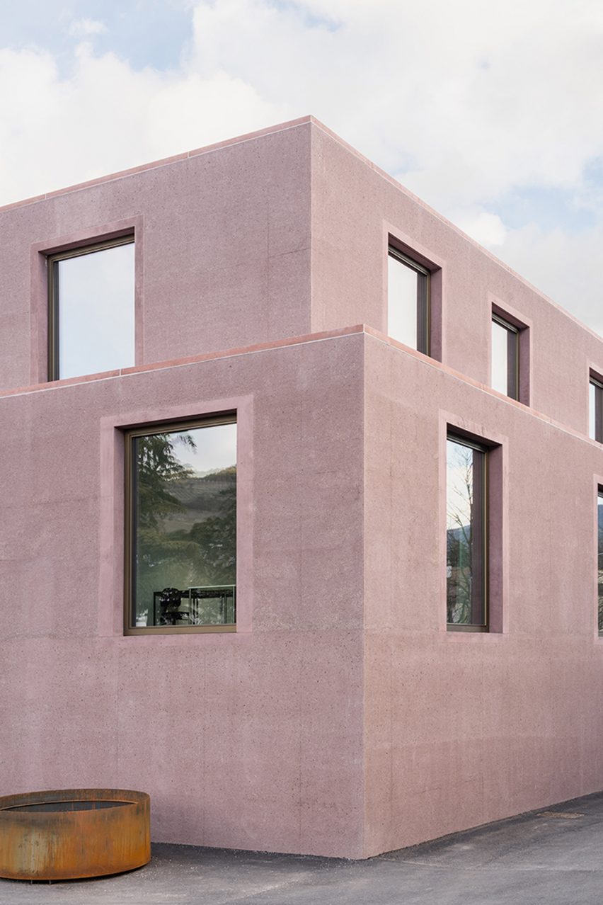Dusty pink concrete volumes at the school building