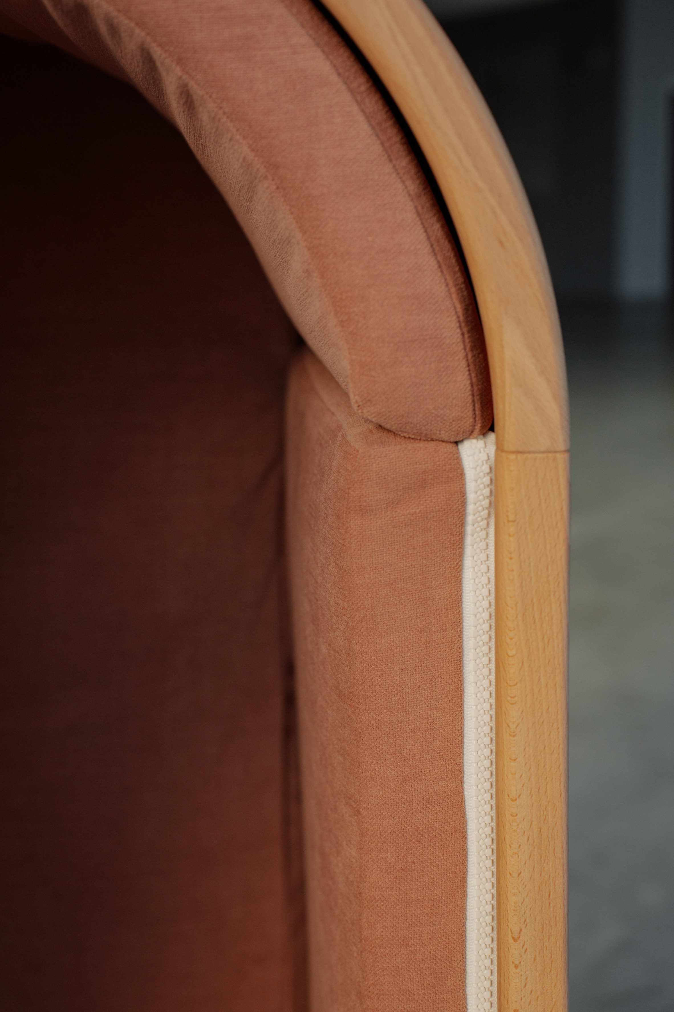 Zipper on side of wooden chair by Alexia Audrain