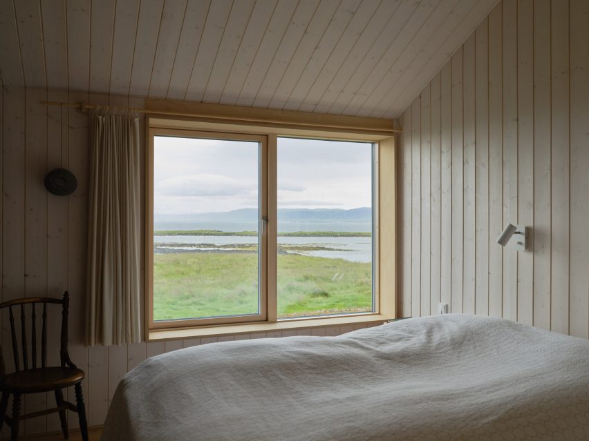 Wood-lined bedroom overlooking Icelandic nature reserve