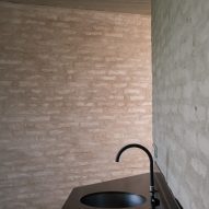 A brick-walled bathroom