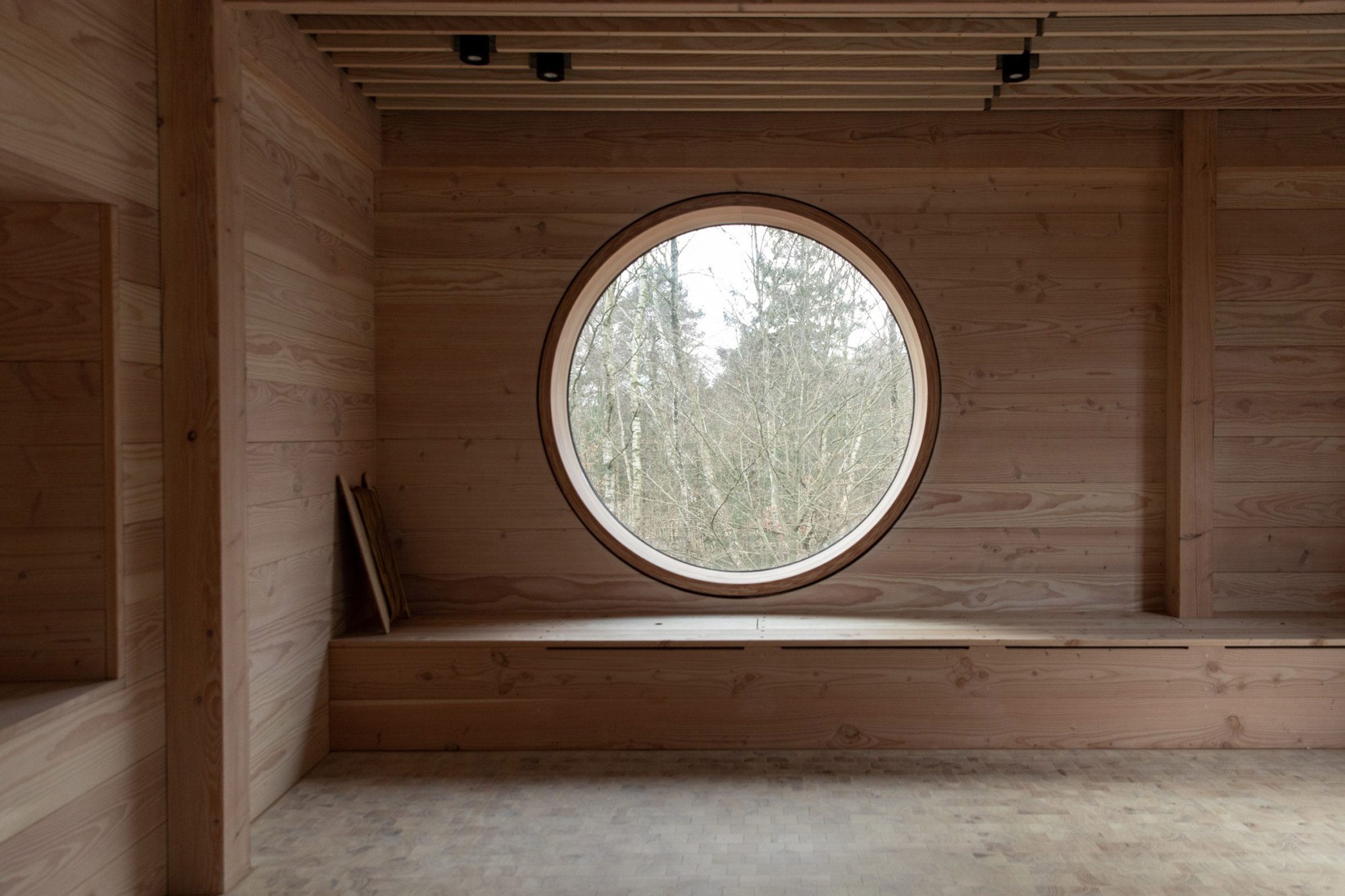 Circular window in Danish timber school by ReVærk