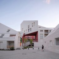 MVRDV slots red-walled courtyard into irregularly shaped French housing