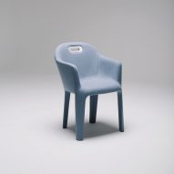 Armchair entirely wrapped in smooth grey fabric