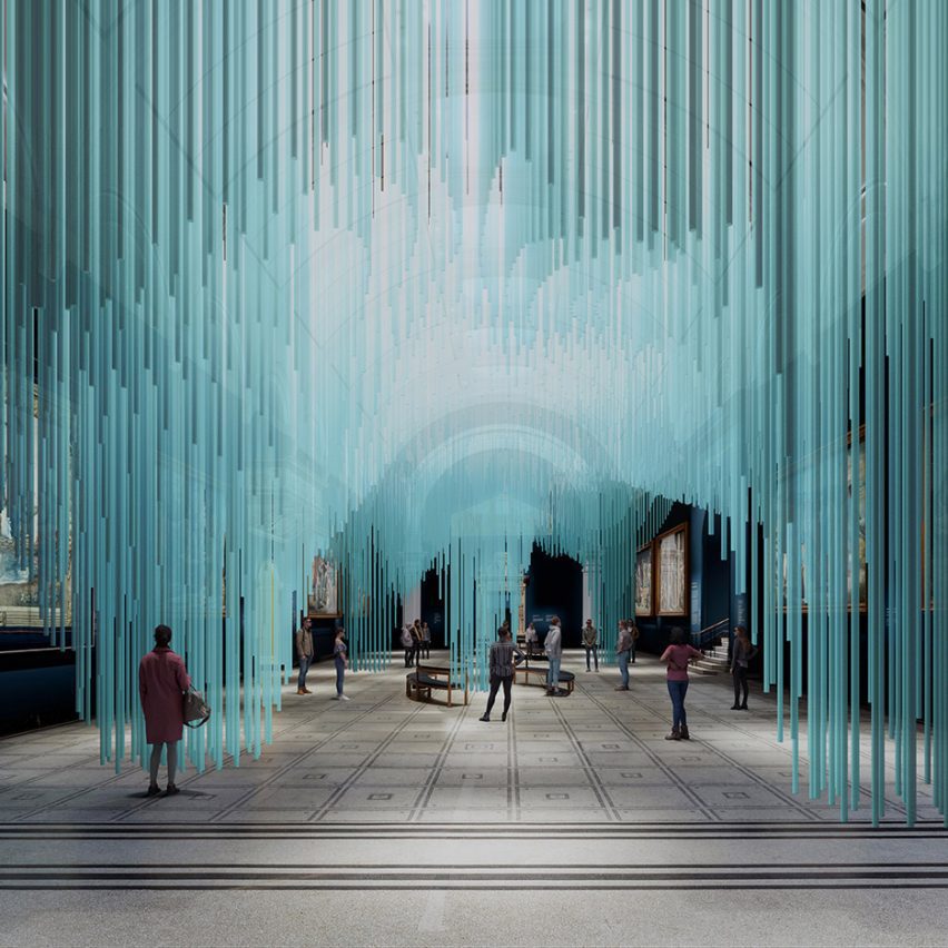 Visitors walk through a blue installation