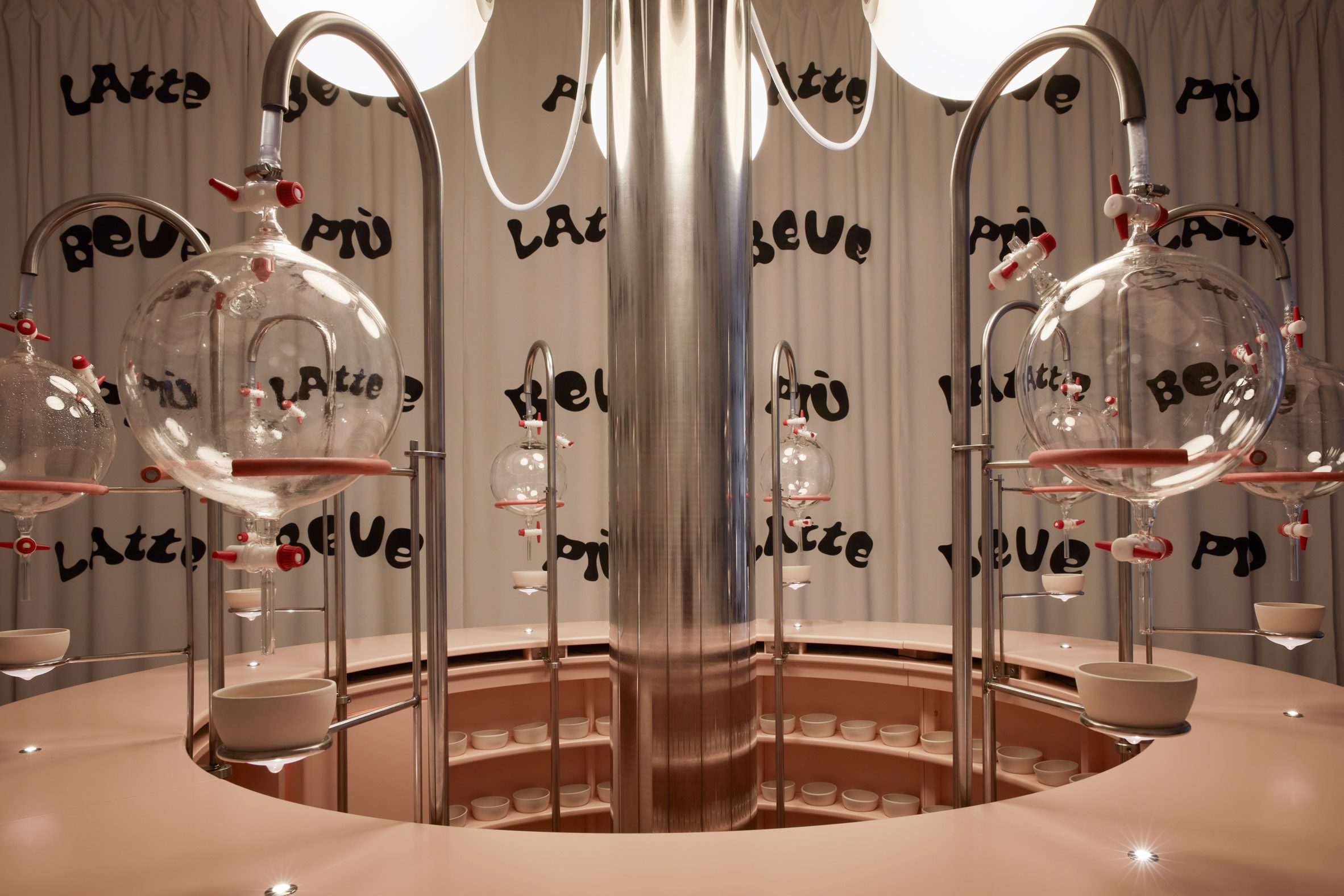 Circular bar with spherical beakers in installation reimagining Clockwork Orange milk bar