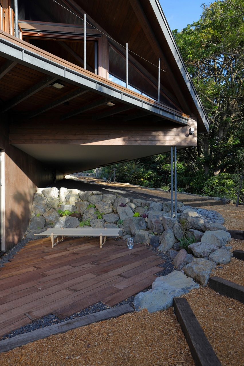 A deck surrounded by rocks is located beneath the overhang at Setoyama