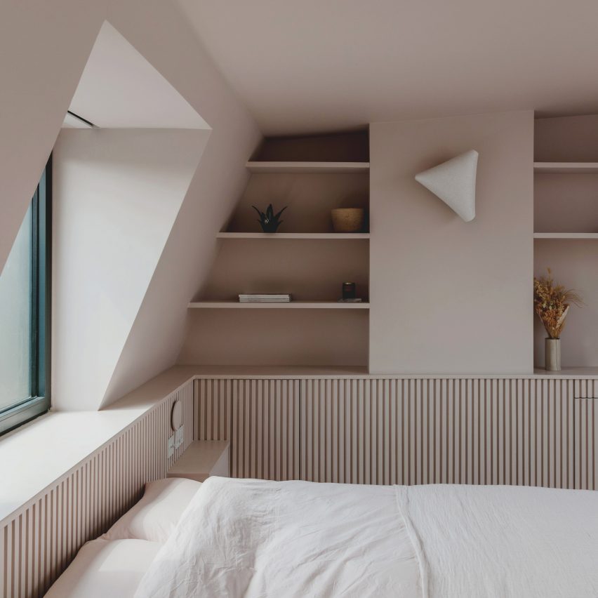 Bed and window in Narford Road loft extension by Emil Eve Architects