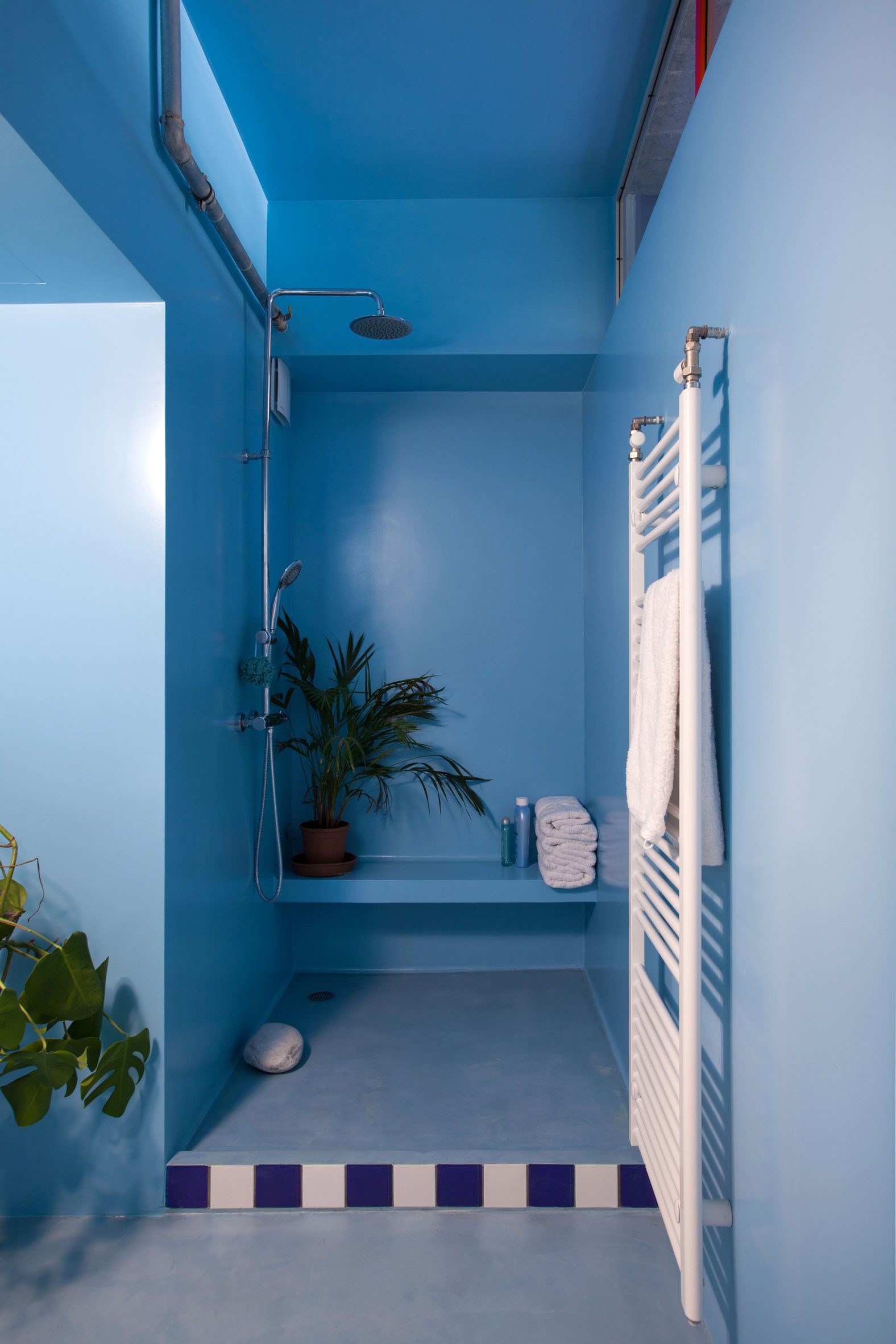 Point Supreme added blue accents to the bathroom