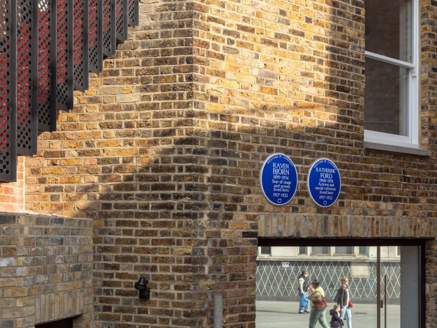 Blue heritage plaques on the exterior of The Queen of Catford by Tsuruta Architects