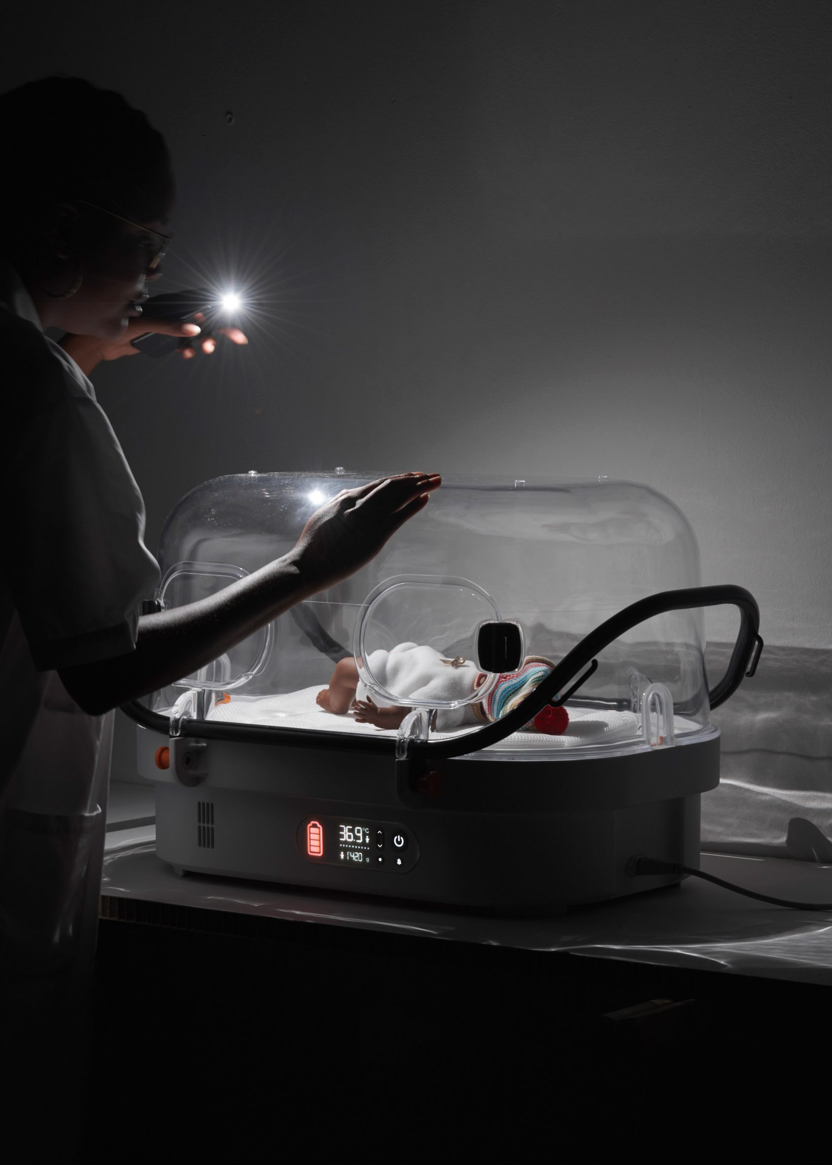 A baby sleeping inside the incubator