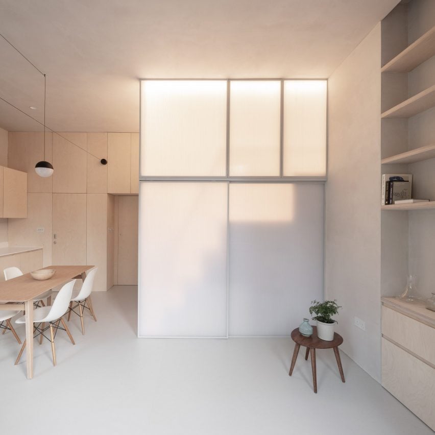 A micro-apartment with an enclosed sleeping area