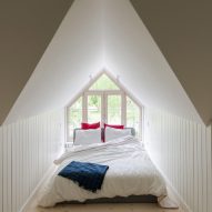A bed was put within a triangular space