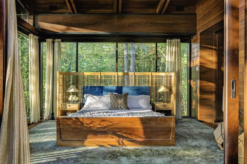 Wood-lined bedroom in Maine house