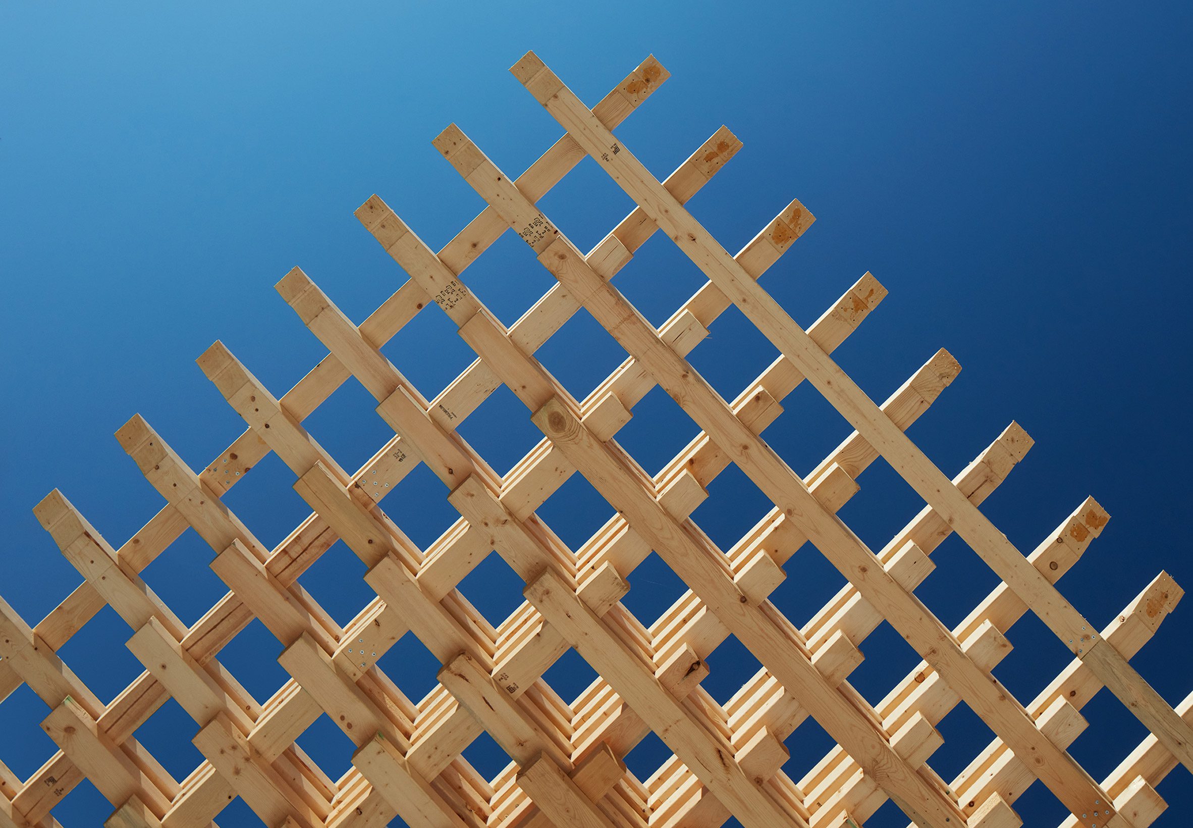 Interlocking wood pieces make up a structural timber framing system