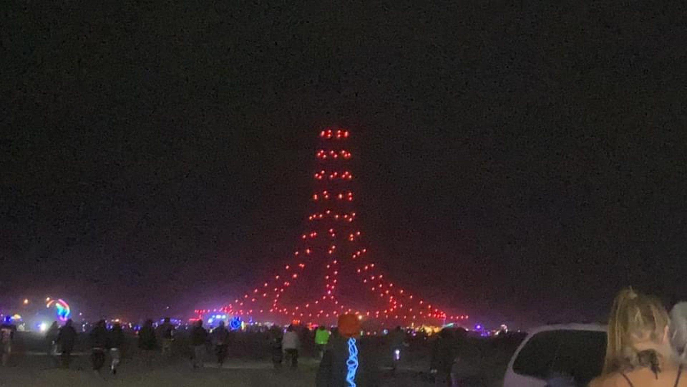 A bell-shaped drone formation at Burning Man