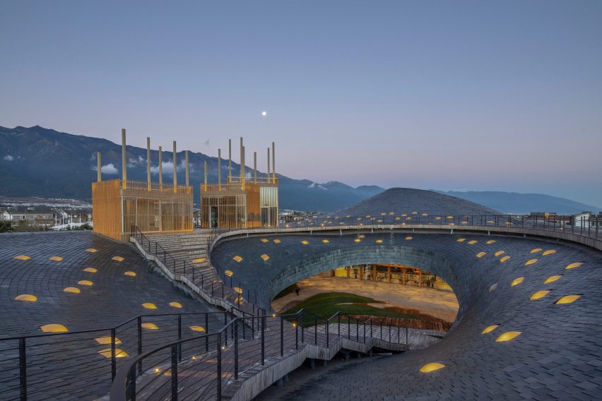 Yang Liping Performing Arts Center has an organic form informed by the mountains