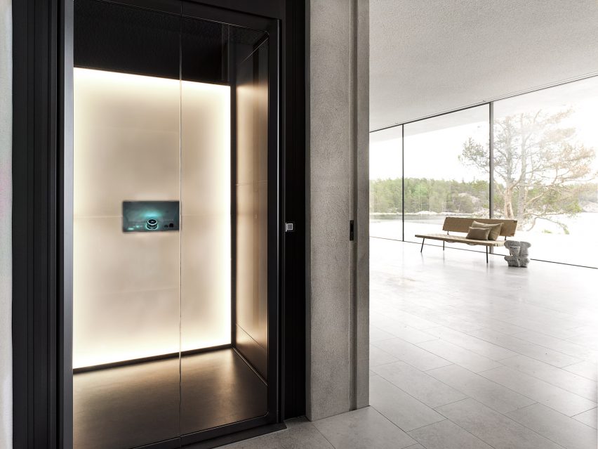 A photograph of a black illuminated Artico lift in a living room