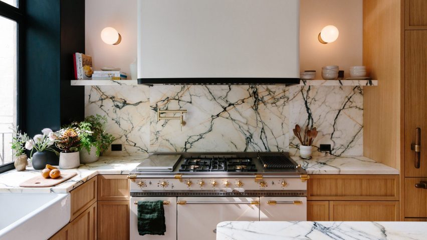 Kitchen with marble backsplash and counters