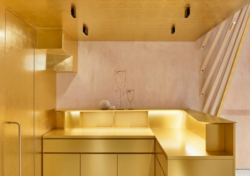 L-shaped Brass counter under mezzanine in Forte Forte Tuscany shop