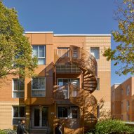Montreal housing complex by Saia Barbarese Topouzanov renovated with colourful spiral staircases