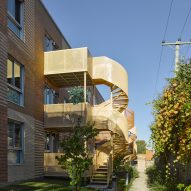 Montreal housing complex by Saia Barbarese Topouzanov renovated with colourful spiral staircases