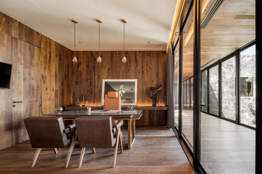 An office interior covered in wooden walls