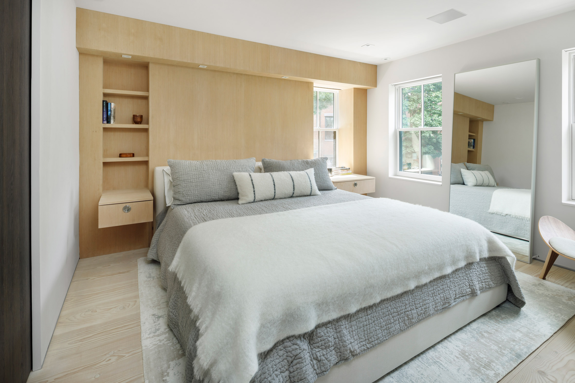 A bedroom has built in cabinetry at boston house