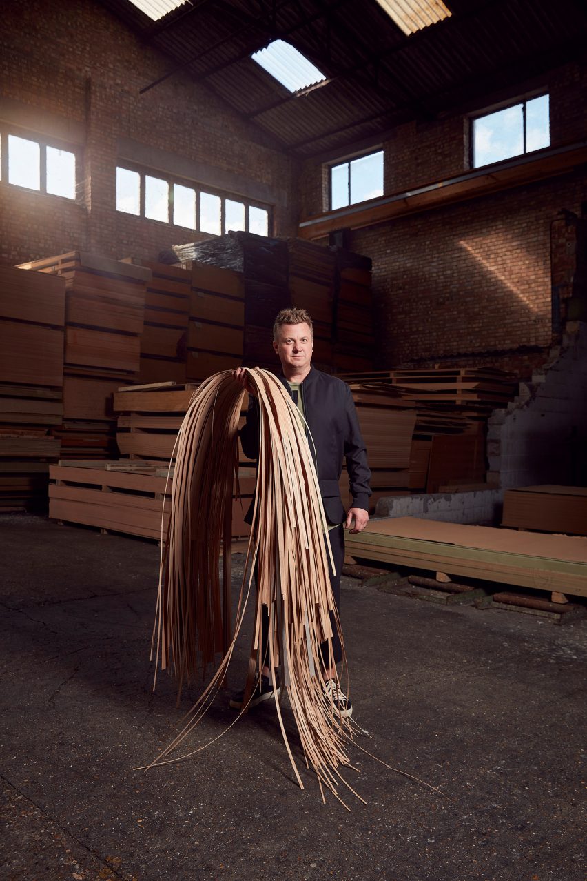 Brodie Neill holding wooden veneers
